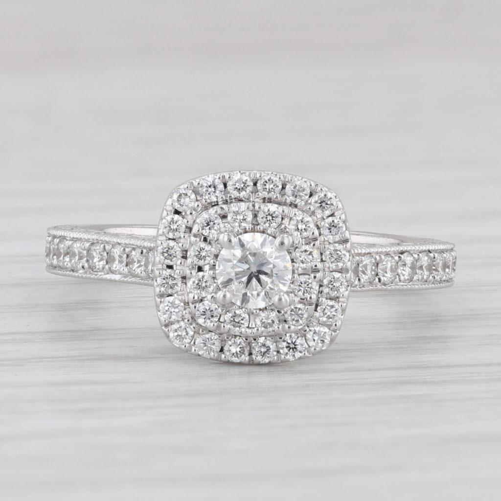 Gemstone Information:
- Natural Diamonds  -
Total Carats - 0.87ctw (0.20ct center, 0.67ctw accents)
Cut - Round
Color - G - H
Clarity - SI1 - I1

Metal: 14k White Gold
Weight: 4.7 Grams 
Stamps: 14k
Face Height: 10 mm 
Rise Above Finger: 7 mm
Band /