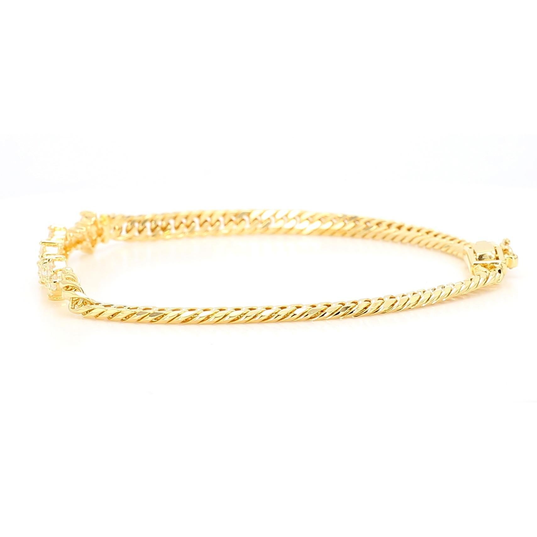 Pulsera de oro amarillo de 18 quilates con una l�ínea de diamantes brillantes redondos engastados en racimo que suman 0,88 quilates en un motivo floral continuo con tramos de cadena de cuerda retorcida. Pesa 8,90 gramos, con la sección de diamantes