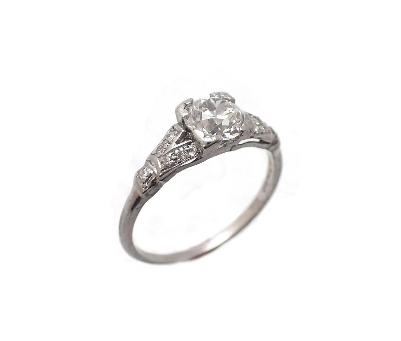 This Art-Deco Engagement ring features a .88ct round old mine cut, H color, VS clarity, that has its origins in a Tifany circle pin.  The mounting must be one of the original precursors to today's popular split shank style. Set in platinum.