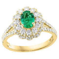0.88 Carat Oval Cut Emerald and Diamond Ring in 18k Yellow Gold