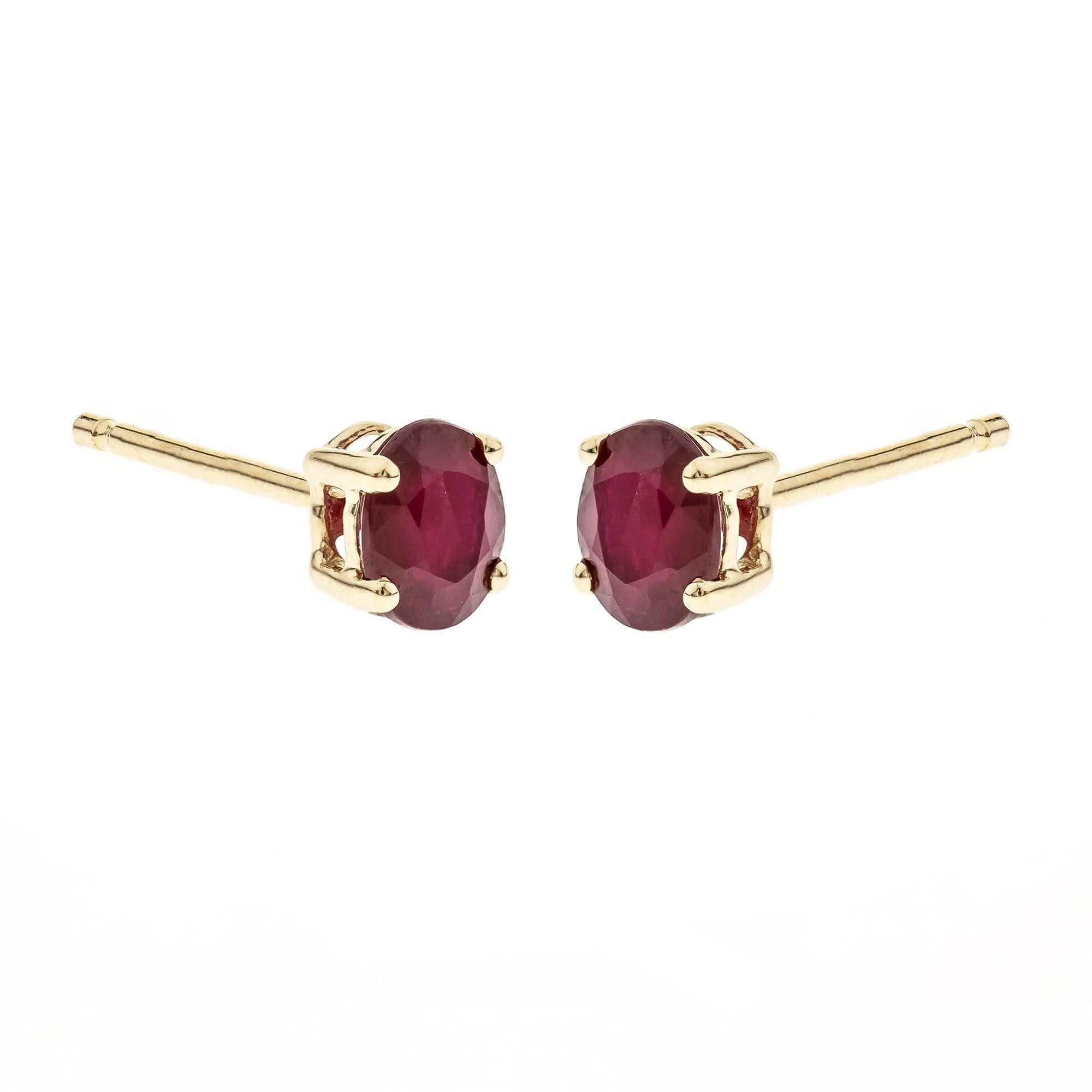 Each of these earrings features a single oval-cut Thai ruby gemstone in a four-prong setting. Style: Stud Gemstone colors: Pink Gemstone shapes: Oval Two prong-set oval-cut Thai rubies each measure 4 mm wide and 5 mm long Total gemstone weight: 7/8