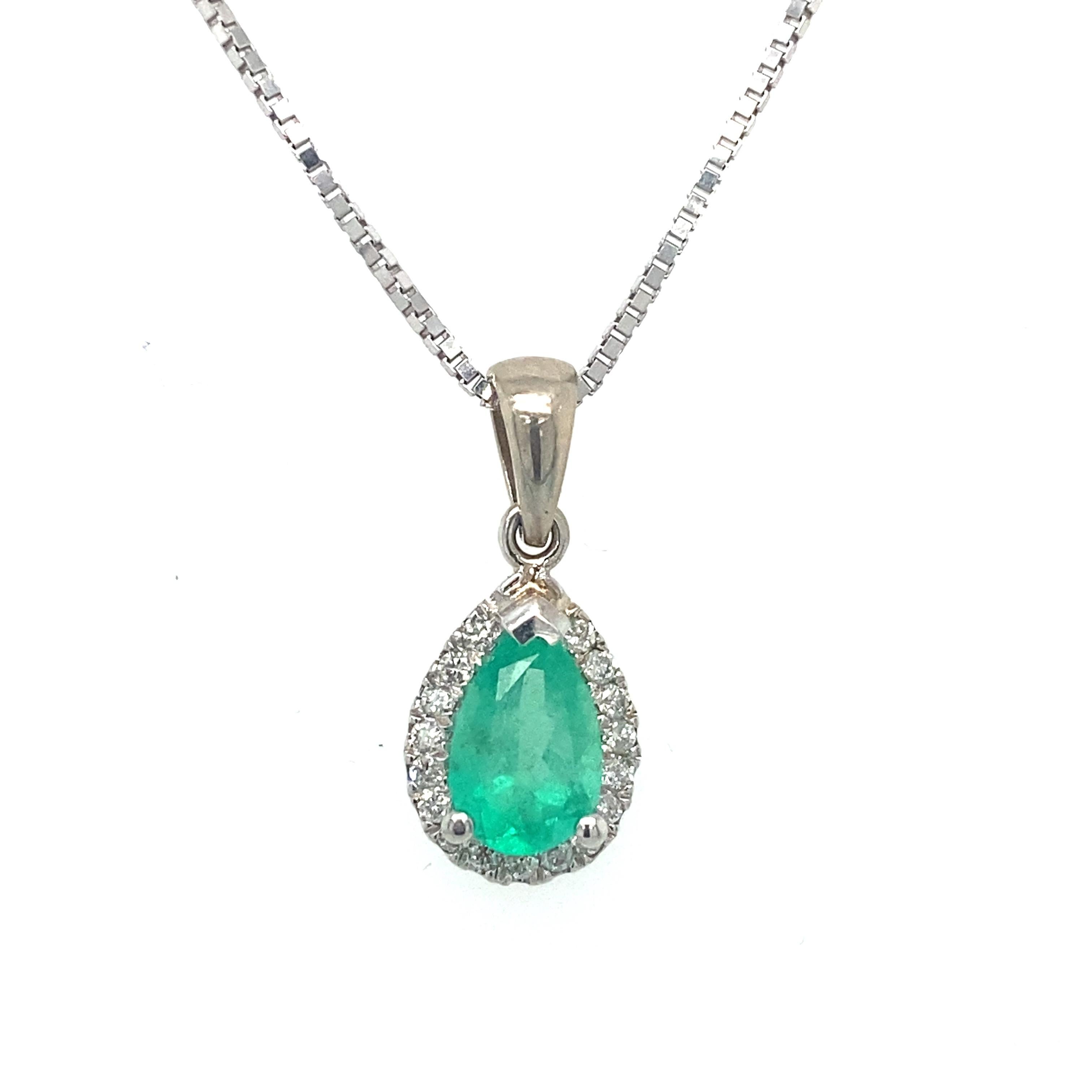 Item Details: This pendant features a center green emerald with a halo of round diamonds.

Circa: 2000s
Metal Type: 14 Karat White Gold
Weight: 3 grams
Size: 16 inch Length necklace

Diamond Details:
Carat: 0.13 carat total weight
Cut: