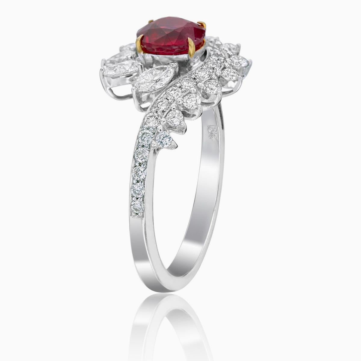 

A ‘Pigeon Blood’ red ruby and diamond solitare ring made in 18 Karat gold. This ring embraces minimalism with its simple design and its color pallete of red and white.

    The center stone is a cushion shaped 0.88 carat GRS certified ‘Pigeon