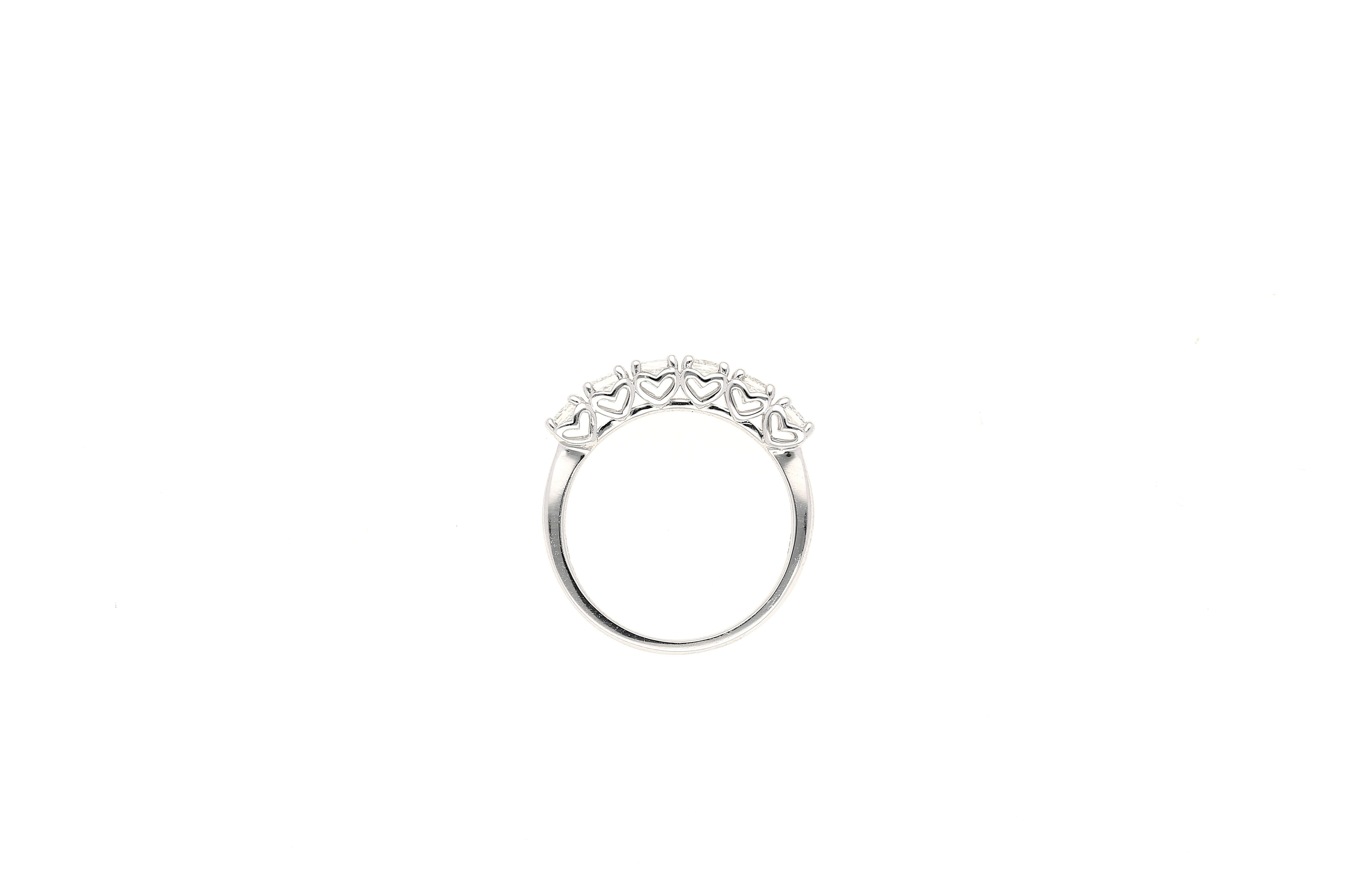6 near-flawless natural princess cut diamonds prong-set in half eternity band ring. All set in 18k solid white gold. The ideal band for stacking or wearing alone. Each diamond is mounted gracefully with 4 prongs. 

Notice how the setting has 6 gold