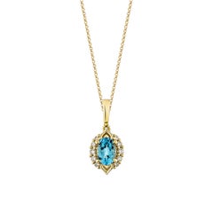 Sunita Nahata 0.88 Carat Swiss Blue Topaz Pendant in 14KYG with White Diamond.
