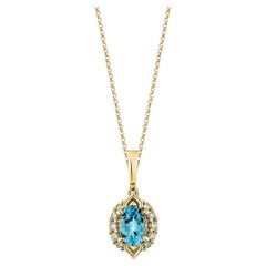Pendentif Sunita Nahata en or 14 carats avec topaze bleue suisse de 0,88 carat et diamant blanc.
