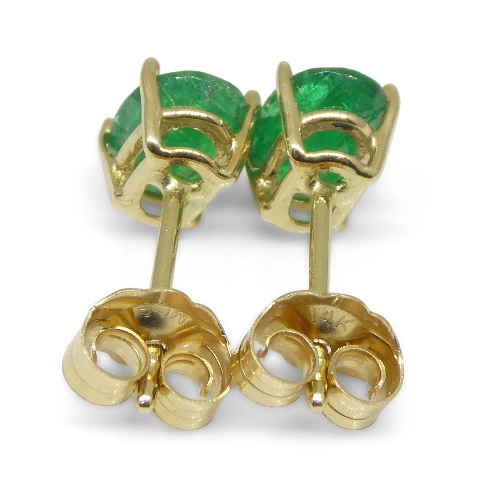 Brilliant Cut 0.88ct Oval Green Colombian Emerald Stud Earrings set in 14k Yellow Gold For Sale