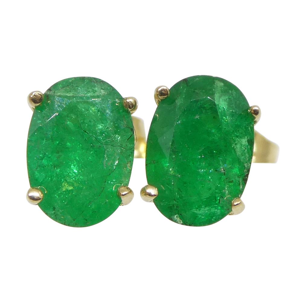 0.88ct Oval Green Colombian Emerald Stud Earrings set in 14k Yellow Gold For Sale 1