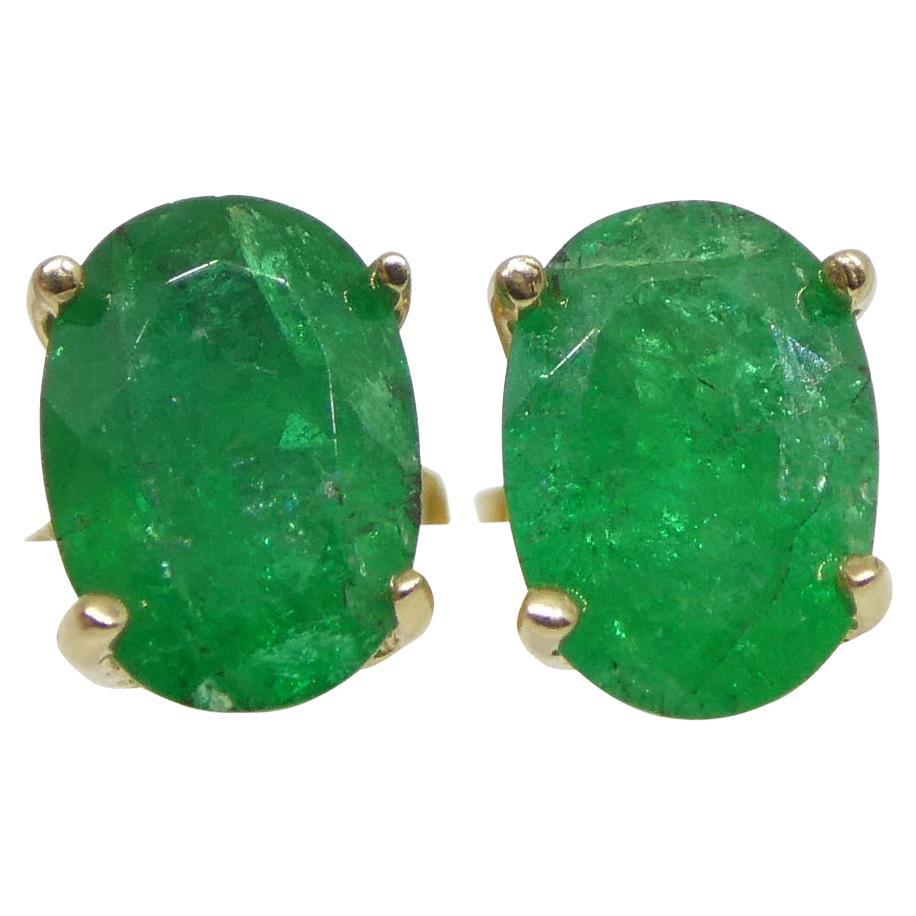 0.88ct Oval Green Colombian Emerald Stud Earrings set in 14k Yellow Gold For Sale