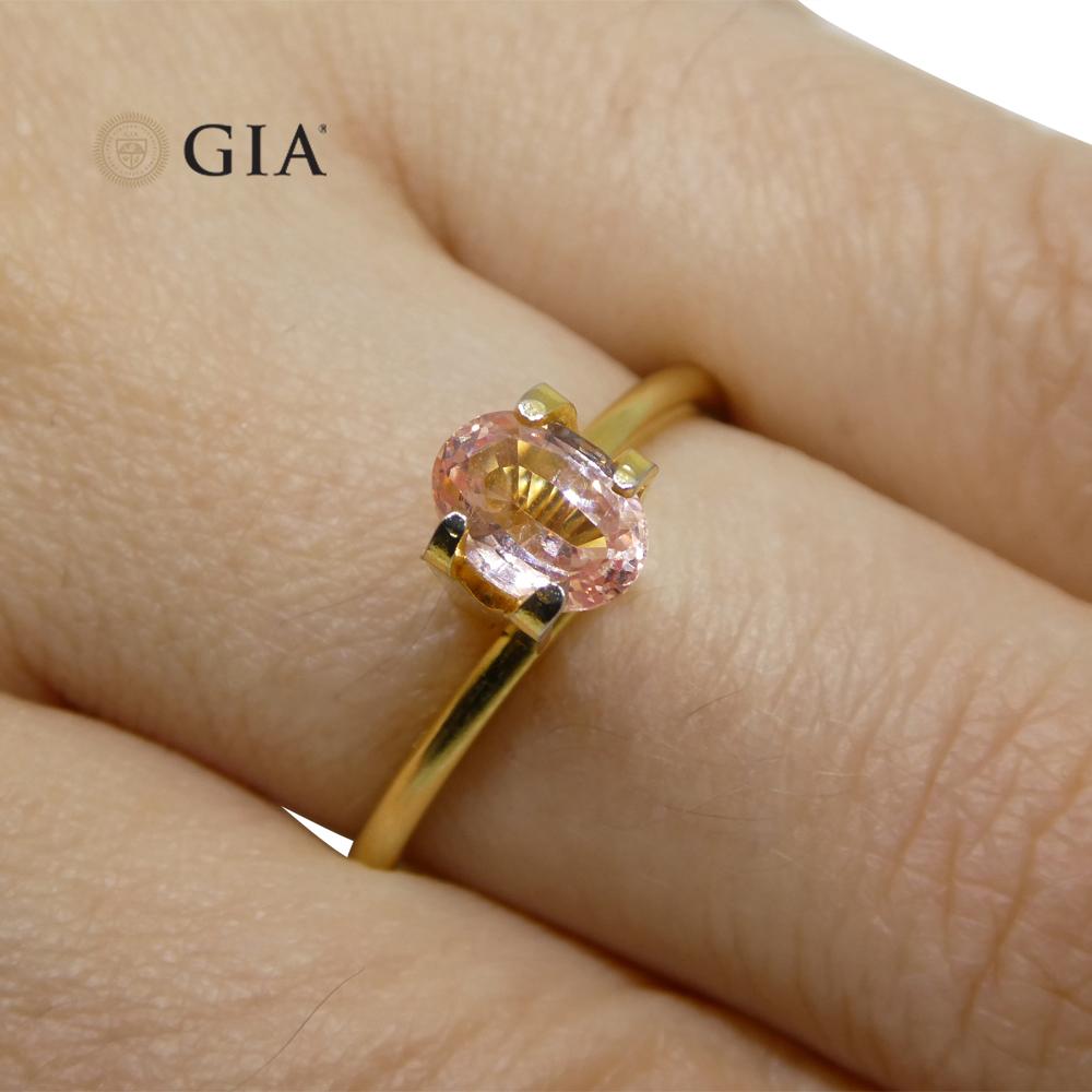Brilliant Cut 0.88 Carat Oval Orangy Pink Padparadscha Sapphire GIA Certified Sri Lanka For Sale