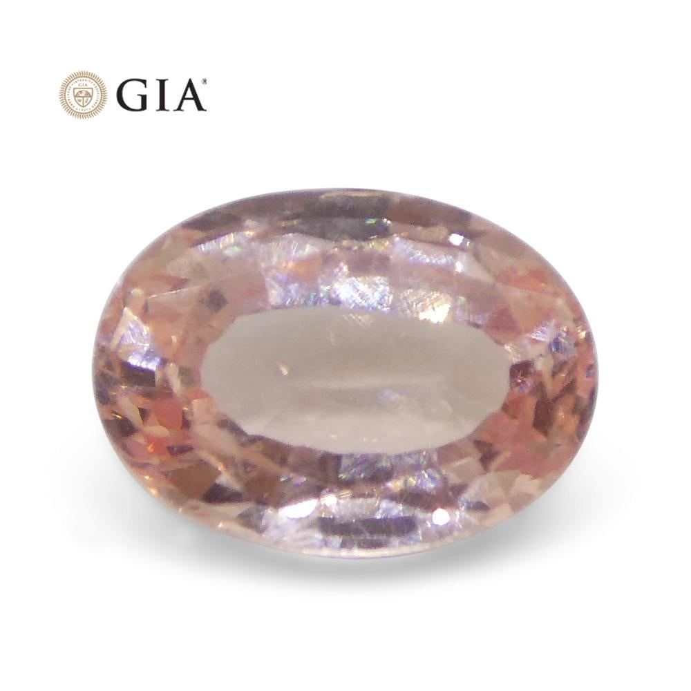 Women's or Men's 0.88 Carat Oval Orangy Pink Padparadscha Sapphire GIA Certified Sri Lanka For Sale