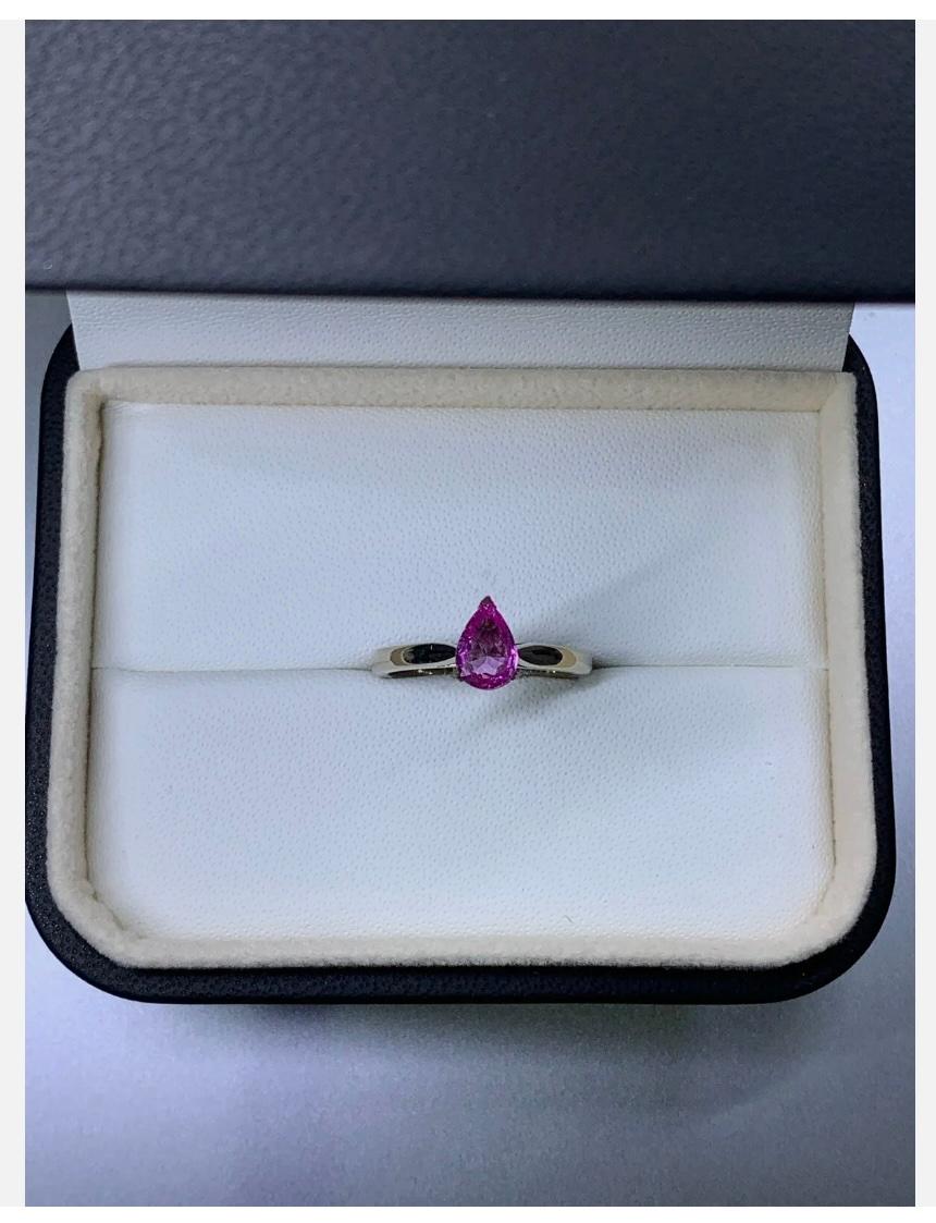 0.88ct Pink sapphire pear shaped solitaire engagement ring in 18ct white gold.

Beautiful engagement ring with pink sapphire pear shape solitaire in 18k white gold on a plain band.

Solitaire chunky engagement ring.

Hallmarked.

Natural untreated