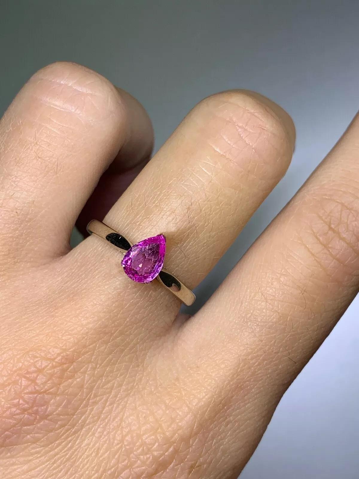 Pear Cut 0.88ct Pink sapphire pear shaped solitaire engagement ring in 18ct white gold. For Sale