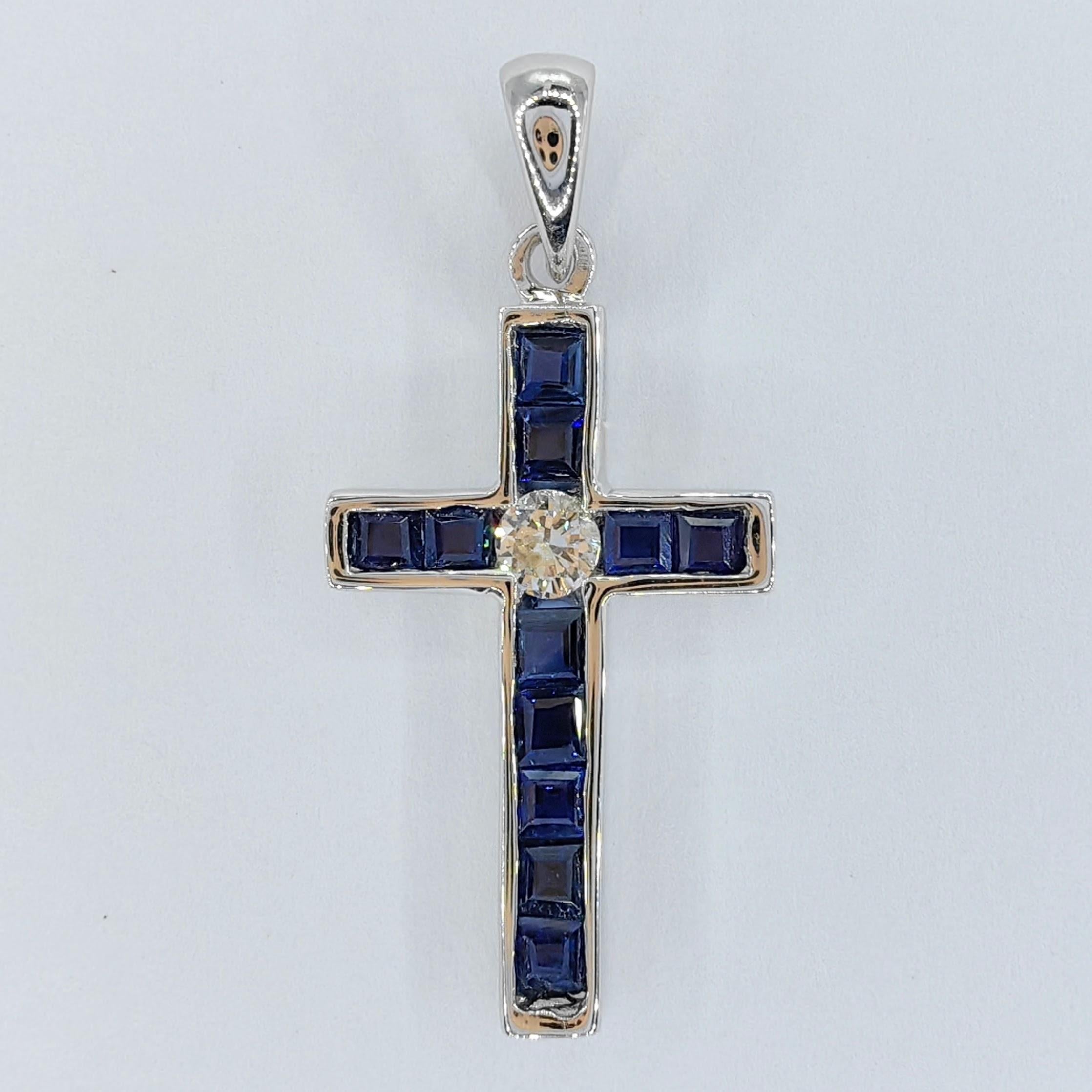 Introducing our exquisite 0.88ct Royal Blue Sapphire & Diamond Cross Necklace Pendant in 18K White Gold. This stunning piece of jewelry combines the regal allure of sapphires with the timeless elegance of diamonds, creating a captivating symbol of