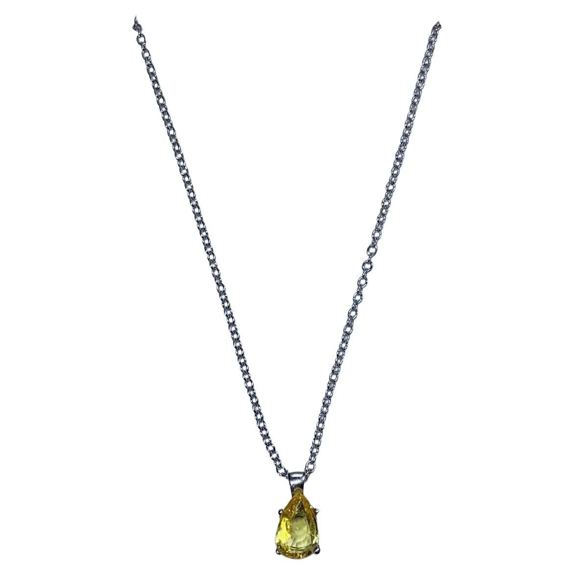 0.88ct Yellow sapphire pear shaped pendant in 18ct white gold. For Sale