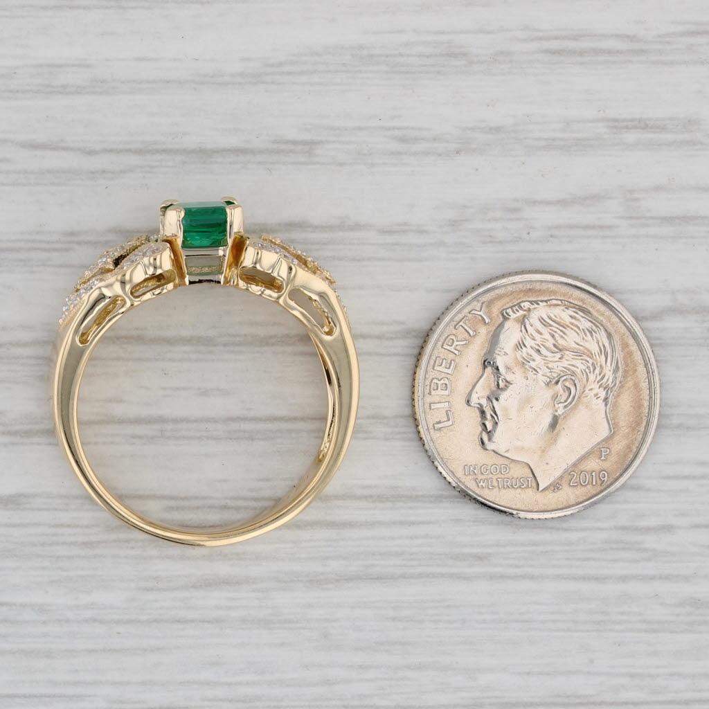 Gemstone Information:
- Natural Emerald -
Carats - 0.65ct
Cut - Emerald
Color - Green
Treatment - Oiling

- Natural Diamonds -
Total Carats - 0.23ctw
Cut - Round Brilliant
Color - E - G
Clarity - VS2

Metal: 18k Yellow Gold
Weight: 6 Grams 
Stamps: