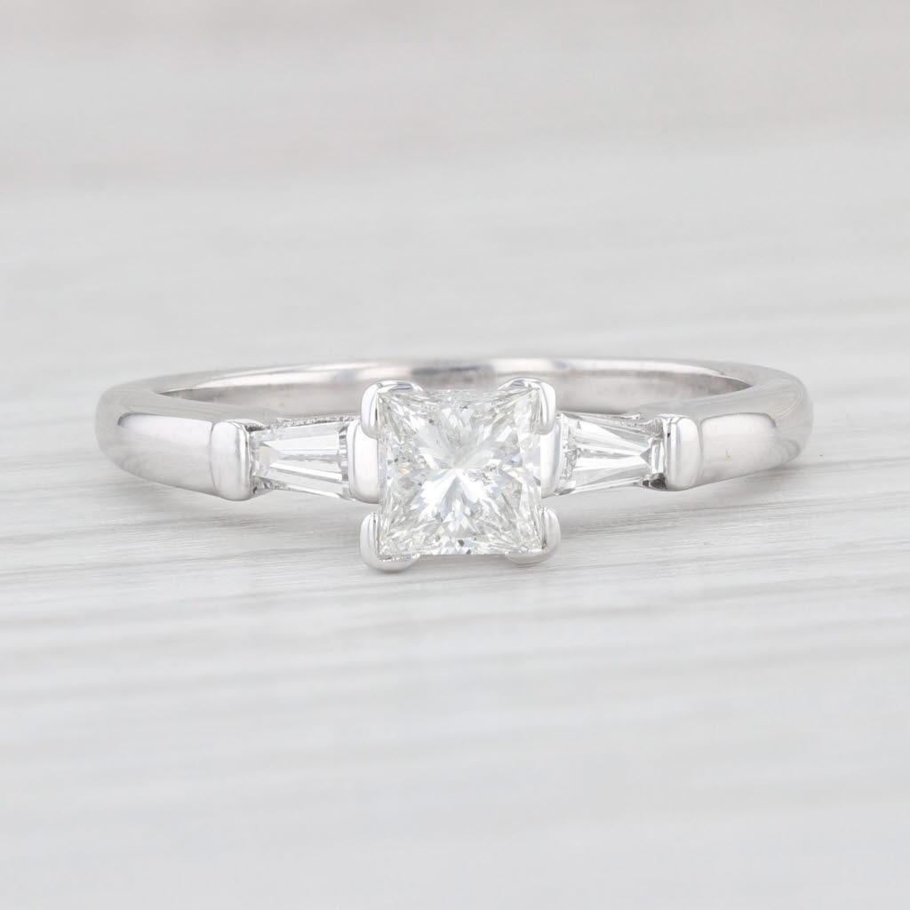 Gemstone Information:
- Natural Diamond Center -
Total Carats - 0.62ct
Cut - Princess Brilliant
Color - H
Clarity - SI3 

- Natural Diamond Accents -
Total Carats - 0.26ctw
Cut - Baguette
Color - F - G
Clarity - VS2 

Metal: 14k White Gold
Weight: