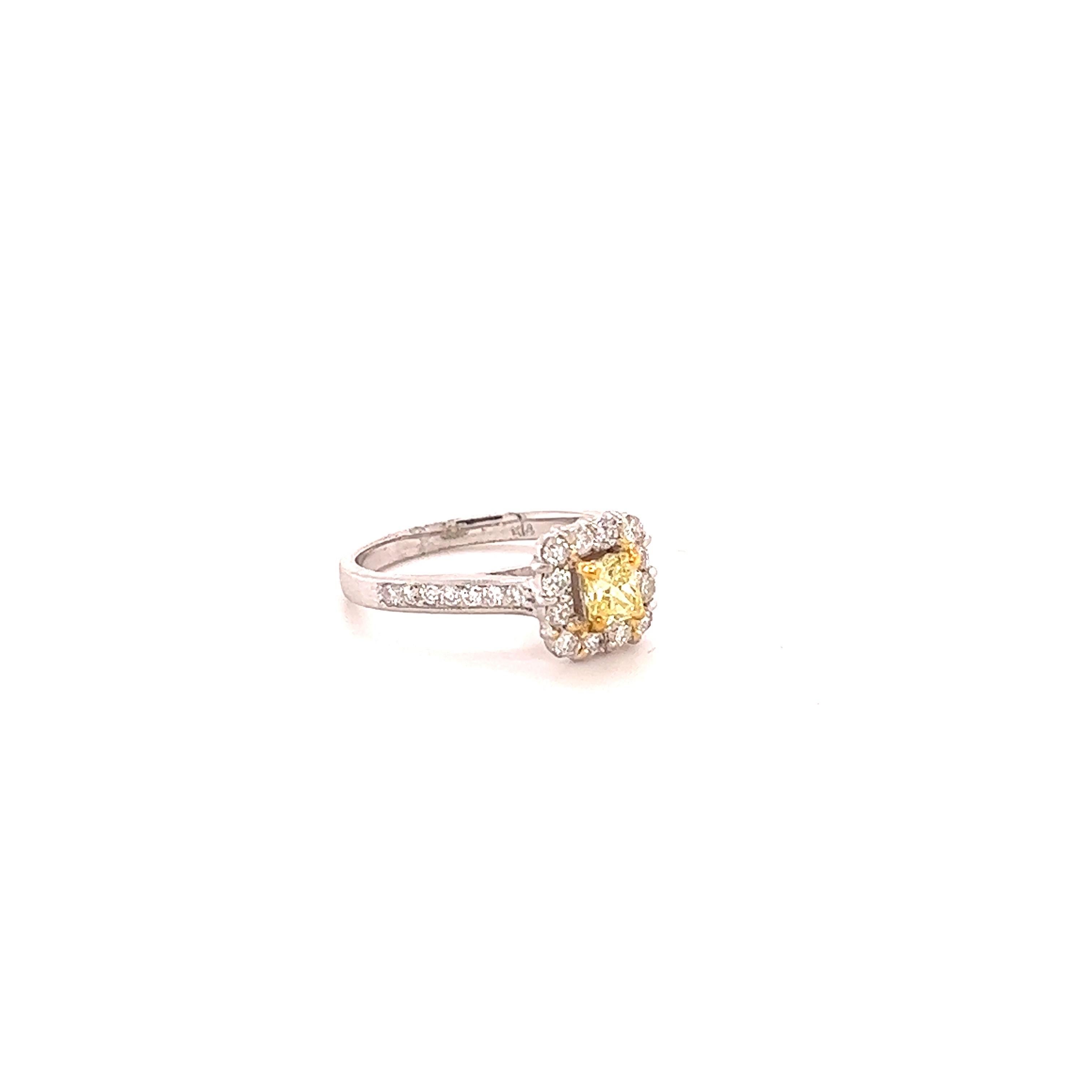 This beautiful engagement ring has a Square Cushion Cut Yellow Diamond that weighs 0.39 carats with a VS Clarity and Color is Fancy Yellow. The measurements of the Yellow Diamond are approximately 4 mm x 4 mm. There are 28 Round Cut Diamonds that