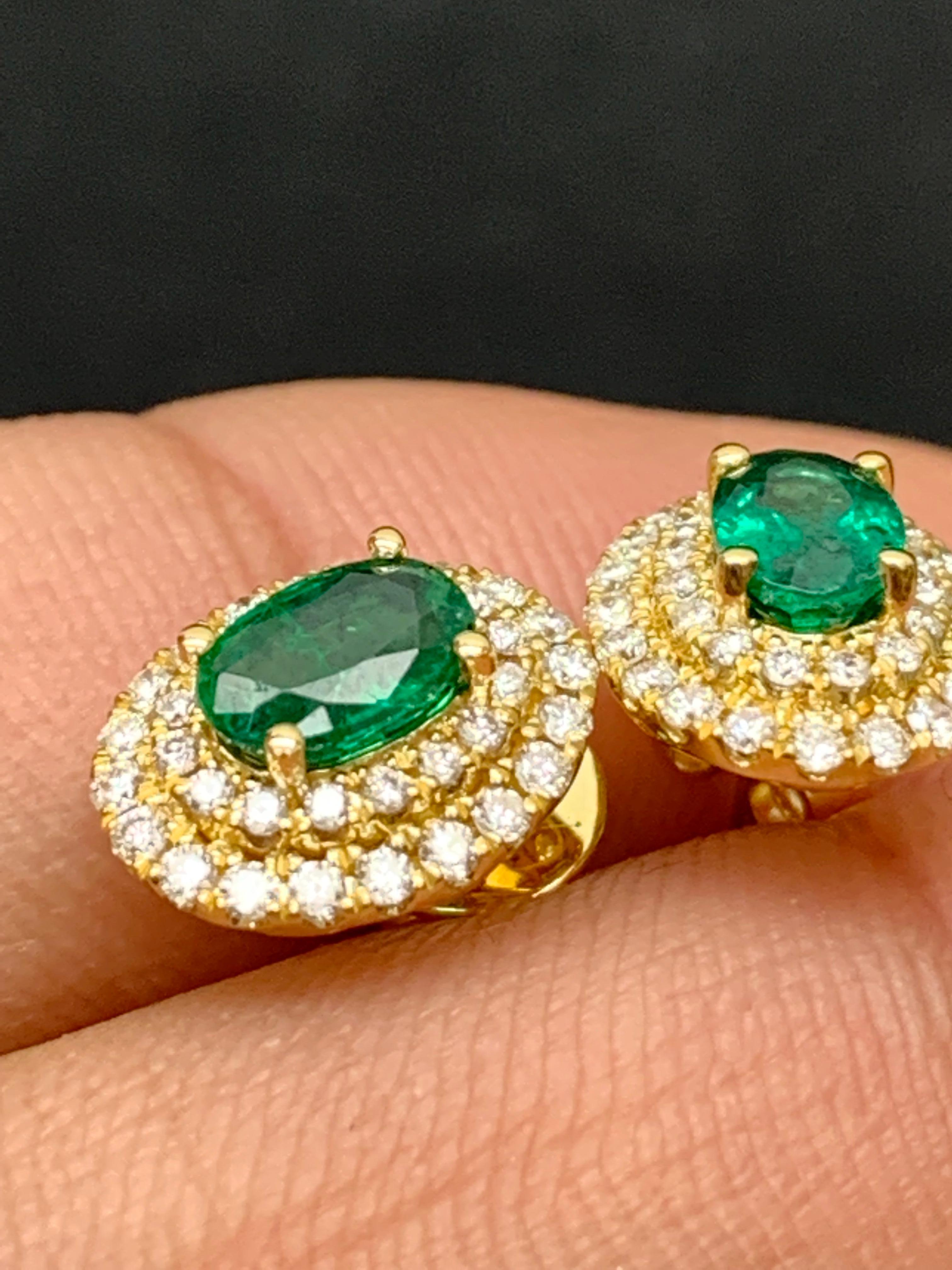 Women's 0.89 Carat Oval Cut Emerald and Diamond Stud Earrings in 18K Yellow Gold For Sale