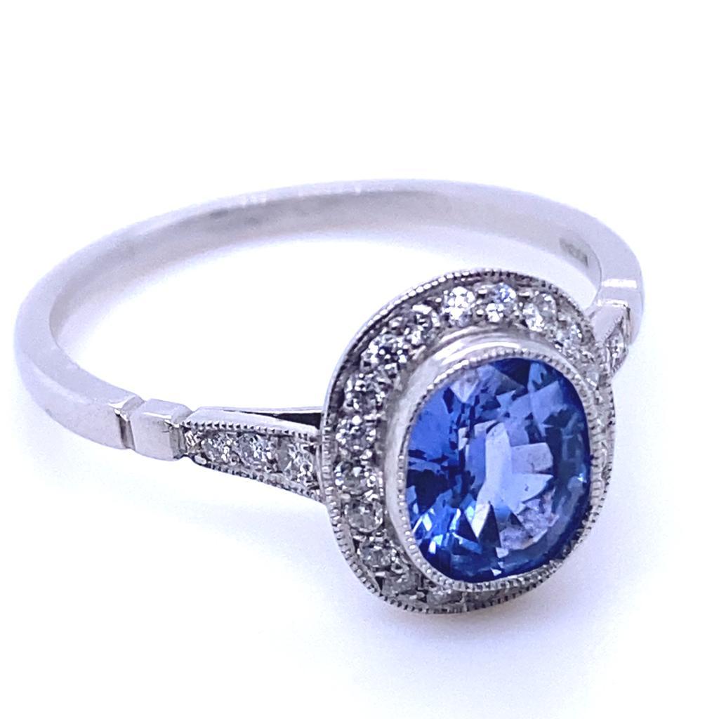 Modern 0.89 Carat Sapphire and Diamond Cluster Platinum Engagement Ring For Sale