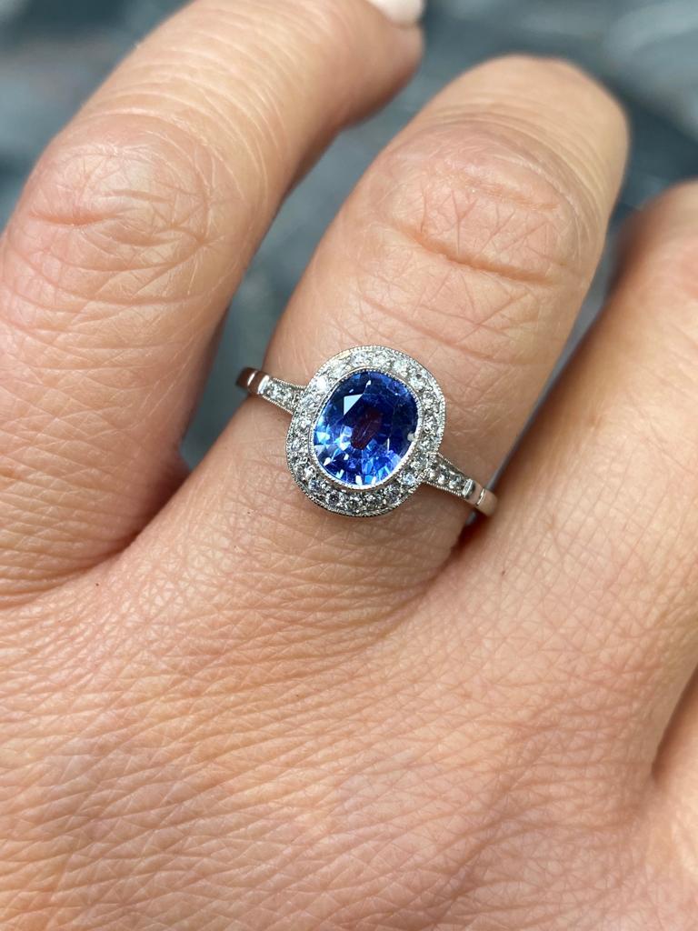Oval Cut 0.89 Carat Sapphire and Diamond Cluster Platinum Engagement Ring For Sale