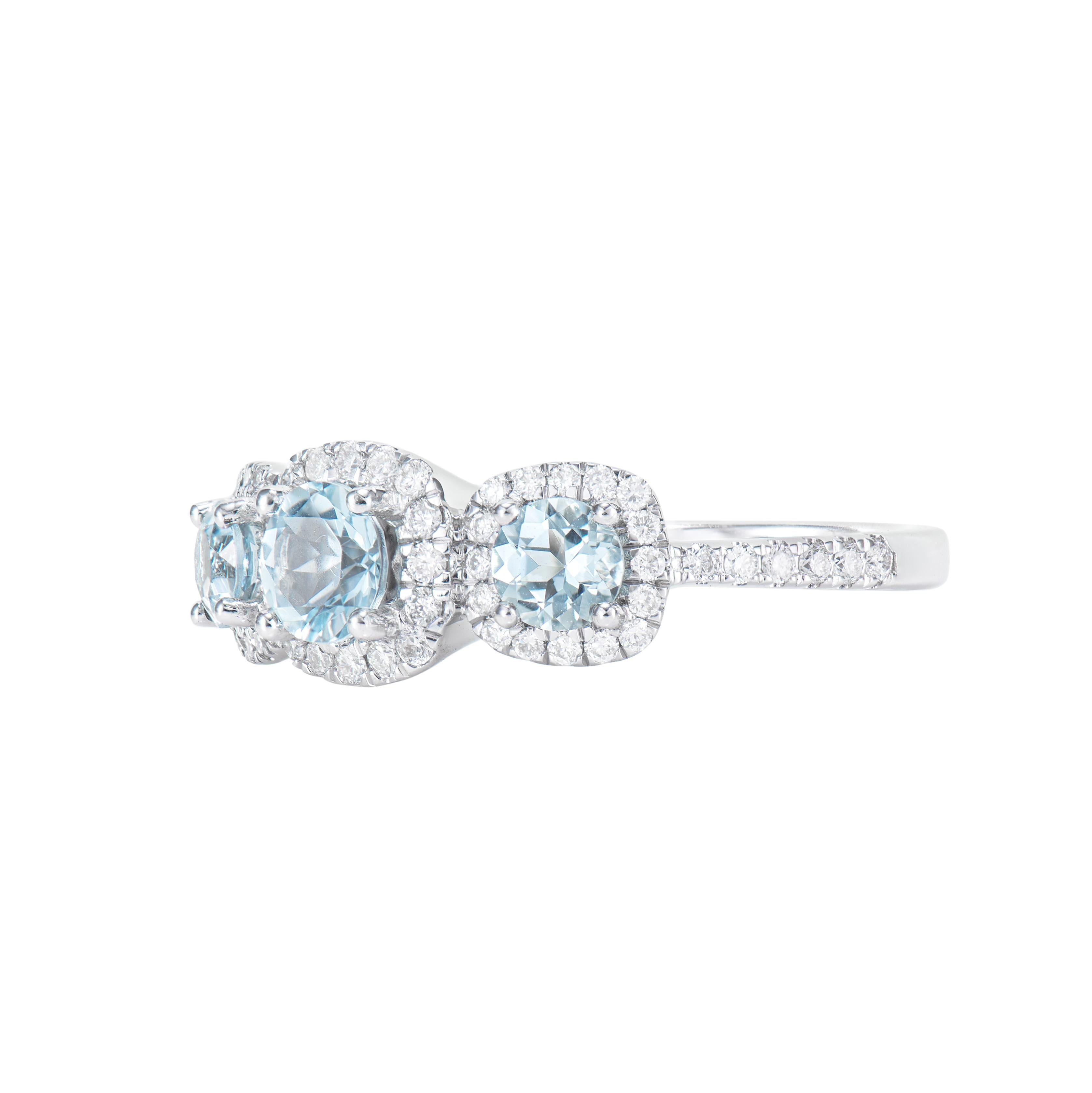 Round Cut 0.89 Carat Three Stone Aquamarine Solitaire Ring in 14KWG with White Diamond. For Sale