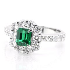 0.89 Carat Vivid Green Emerald and Diamond Halo Ring Set in Platinum