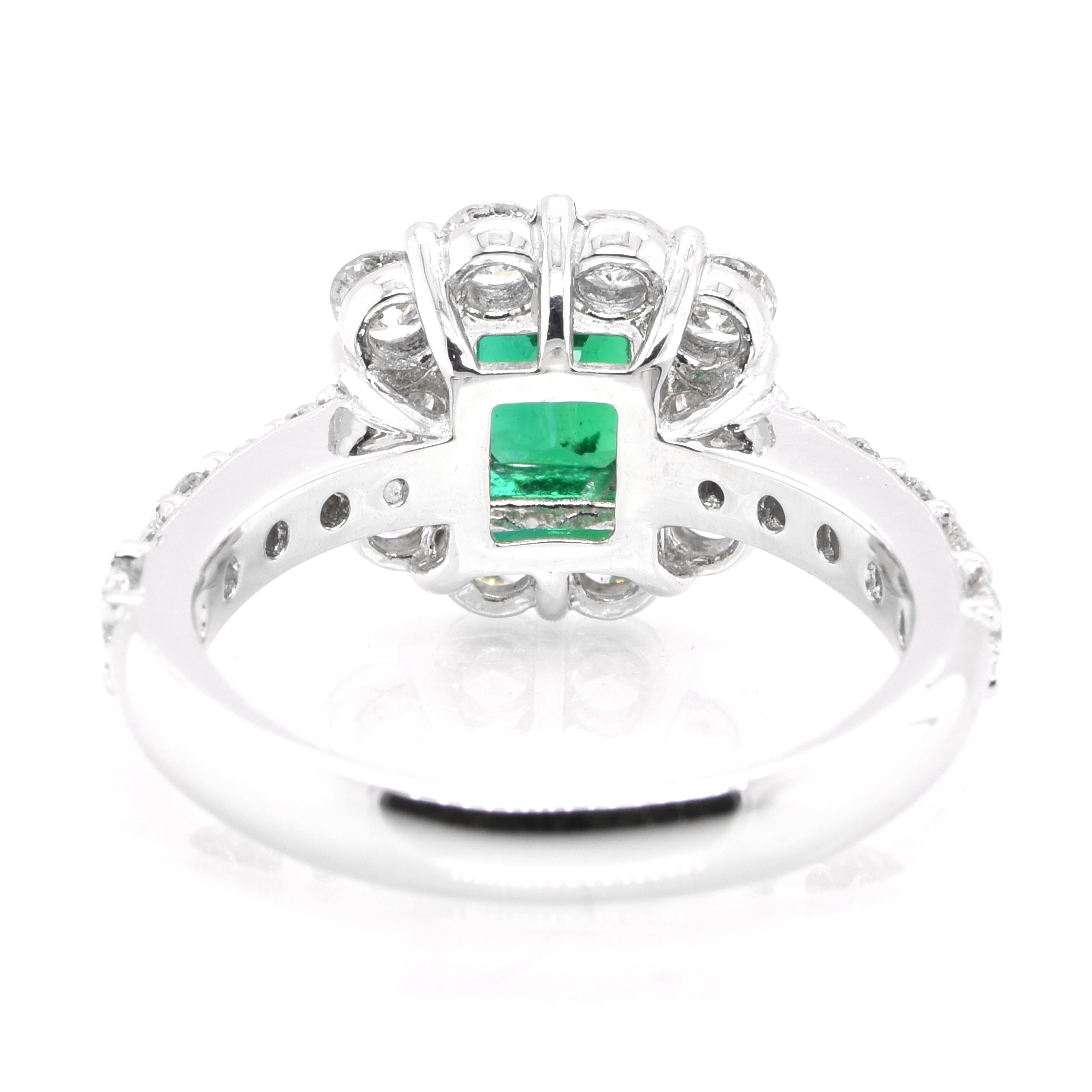 Women's 0.89 Carat Vivid Green Emerald and Diamond Halo Ring Set in Platinum For Sale