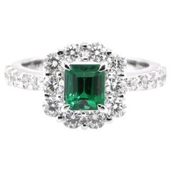 0.89 Carat Vivid Green Emerald and Diamond Halo Ring Set in Platinum