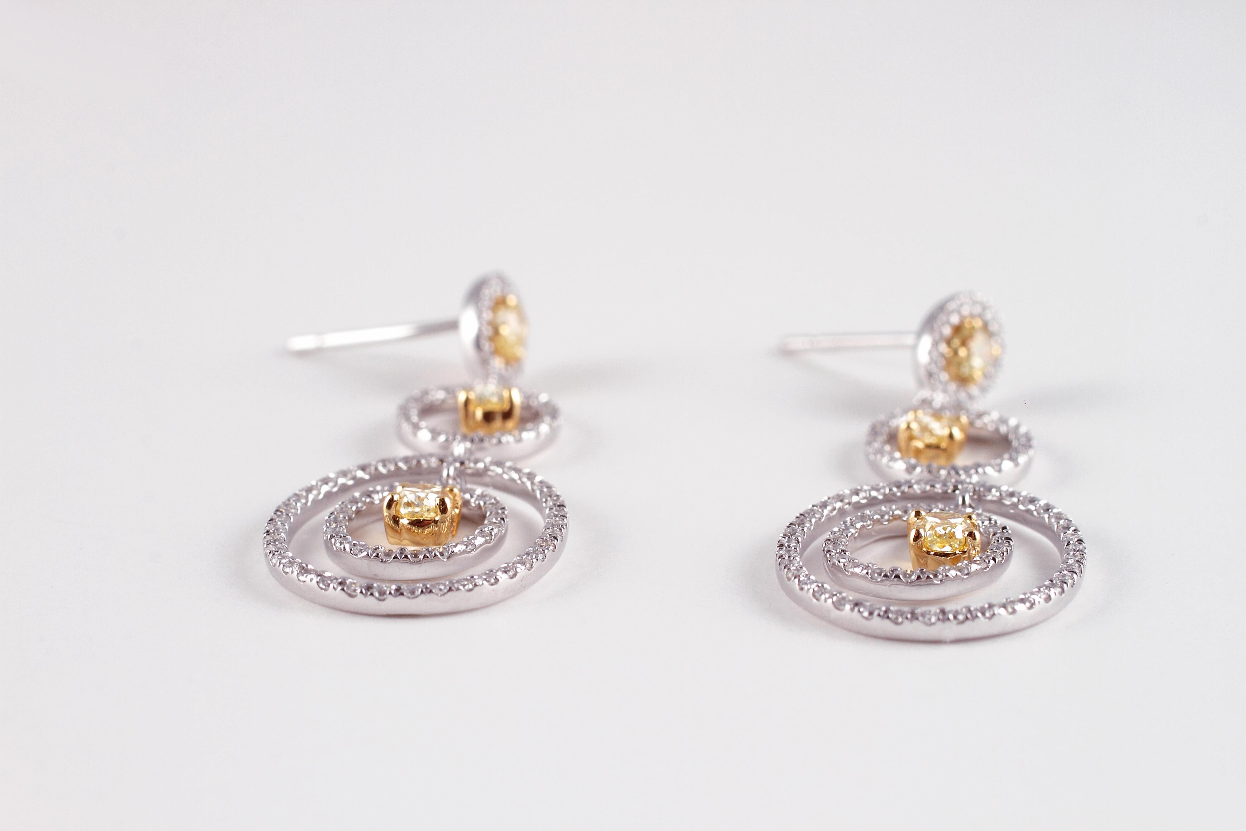 Oval Cut 0.89 Carat Yellow Diamond 0.77 Diamond White Gold Earrings