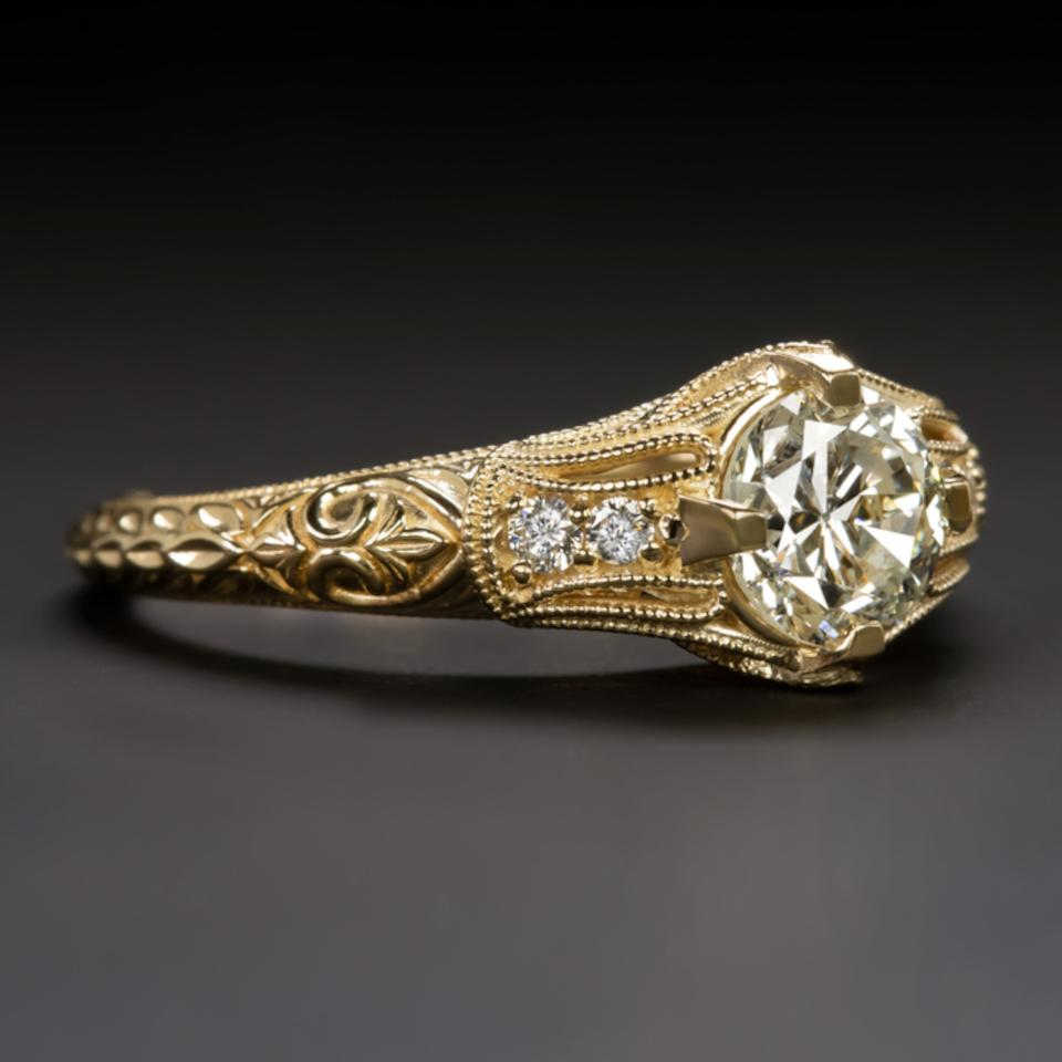 0.82 carat European cut diamond engagement ring set in an antique and romantic, timeless design. The diamond was hand cut a lifetime ago during the 1920s and 1930s. The diamond is perfectly integrated into the absolutely classic antique style yellow