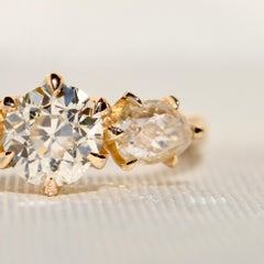 0.89ct old European and old pear cut diamond three stone engagement ring
