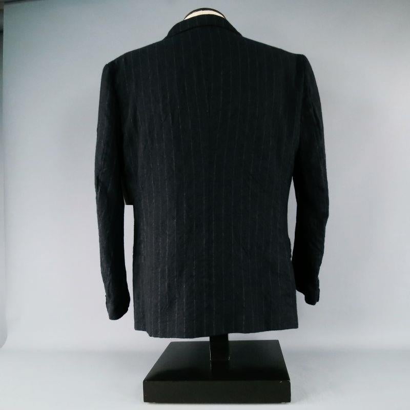 KIMINORI MORISHITA for O8SIRCUS.
 Brush wool sport coat with hand ruched darts.
 Subtle chalk stripes.
 2 Button, notch lapen.
 Dual flap pockets.
 Lined through body of garment.
 Made in Japan.
 Excellent Pre-Owned Condition.Marked As: 4/52Fits