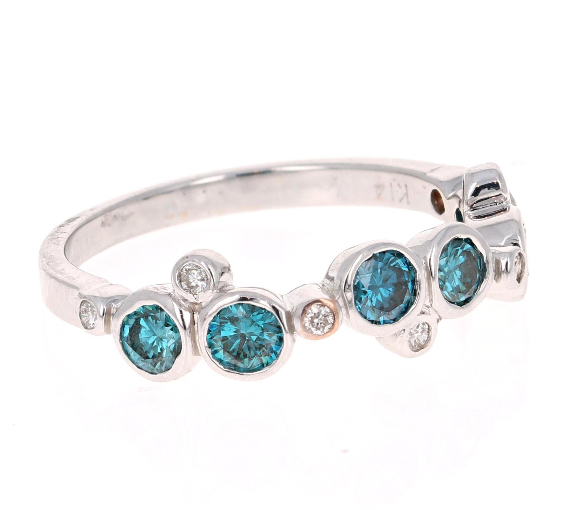 Cute and Dainty 0.90 Carat Blue Diamond and White Diamond Band that is sure to be a great addition to anyone's accessory collection.   There are 6 Round Cut Blue Diamonds that weigh 0.82 carats and 7 Round Cut Diamonds that weigh 0.08 carats.  The