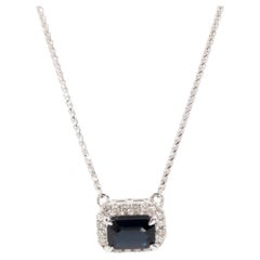 0.90 Carat Deep Blue Sapphire and Diamond Halo Pendant in 9 Carat White Gold