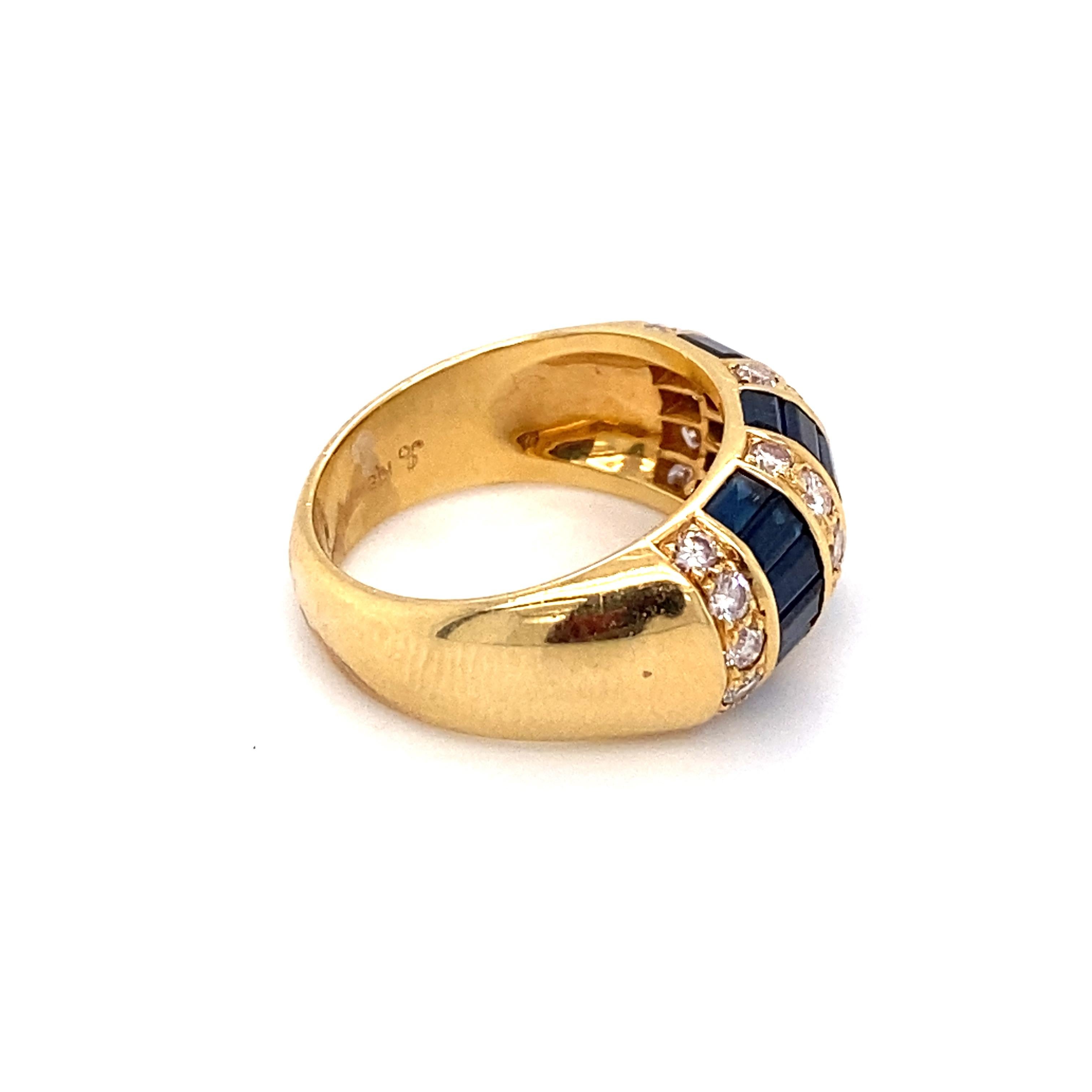 Circa: 1980s
Metal Type: 18 Karat Yellow Gold
Weight: 8.2 grams
Size: US 6, resizable

Diamond Details:
Carat: 0.90 carat total weight
Cut: Round
Color: G
Clarity: VS

Sapphire Details: 
Carat: 1.10 carat total weight
Cut: Baguette
Color: Royal blue