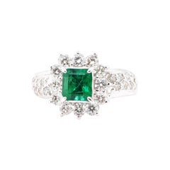 0.90 Carat Natural Vivid Green Emerald and Diamond Ring Set in Platinum