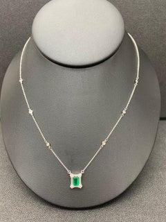 0.90 Carat Emerald Cut Emerald and Diamond Pendant Necklace in 14K White Gold