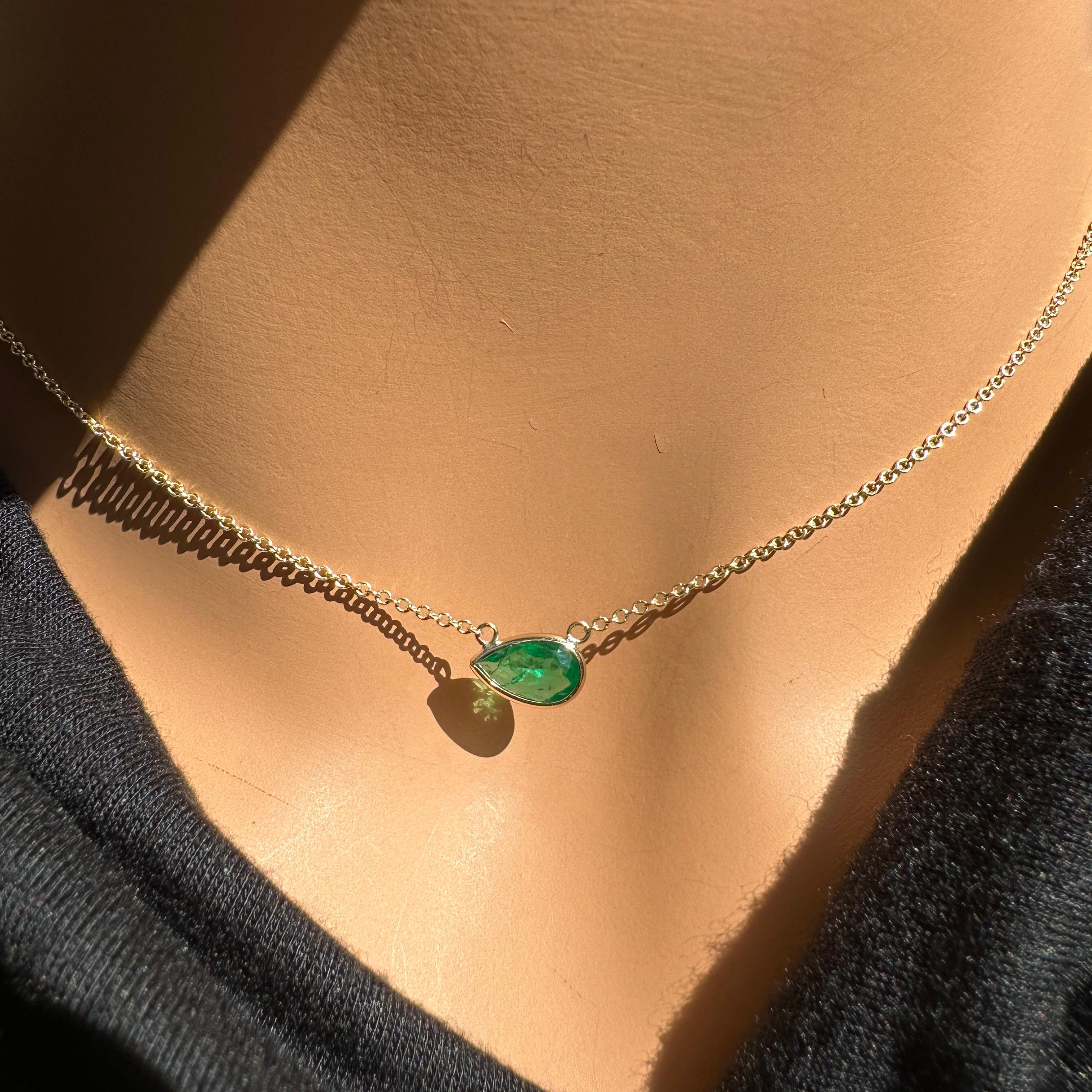 A fashion necklace made of 14k yellow gold with a main stone of a pear-shaped emerald weighing 0.90 carats and certified by IGITL would be a stunning and elegant choice. Emeralds are known for their rich green color and timeless beauty, and the pear