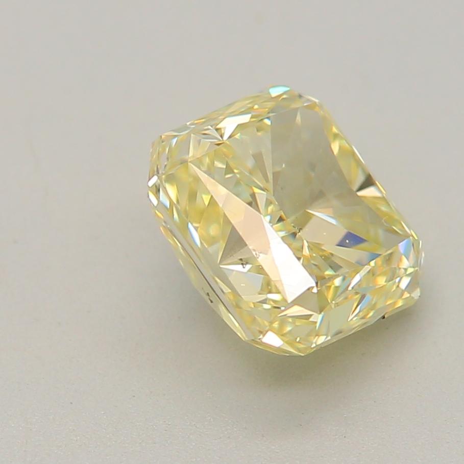 Women's or Men's 0.90 Carat Fancy Light Yellow Radiant cut diamond SI2 Clarity GIA Certified For Sale
