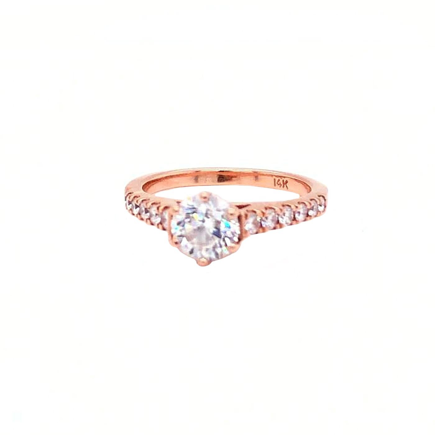 Beautiful solitaire with accents style GIA certified diamond engagement ring. The ring features a 0.90 carat round cut 100% eye clean natural diamond of E color and SI1 clarity and it is surrounded by smaller natural diamonds of approx. Set in a