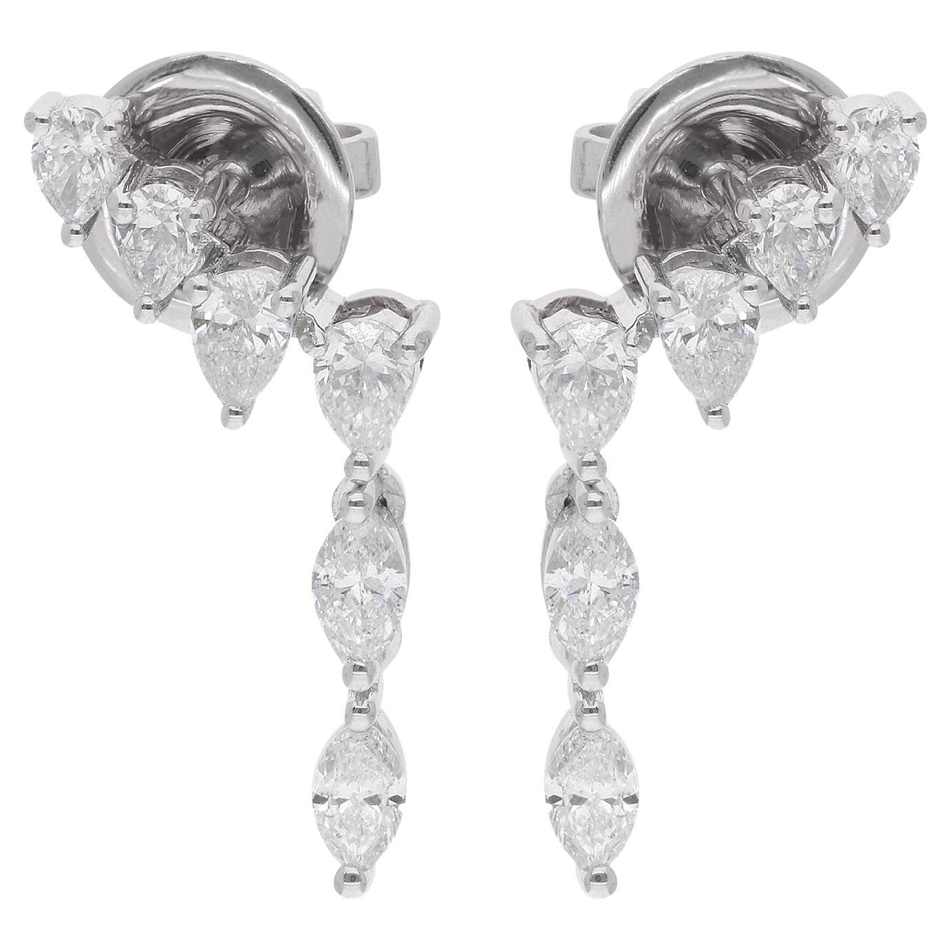 Earrings featuring 0.90 carat pear and marquise diamonds in 14 karat white gold are a beautiful and elegant piece of handmade fine jewelry. Each earring showcases a combination of pear-shaped and marquise-shaped diamonds.

The pear-shaped diamond is