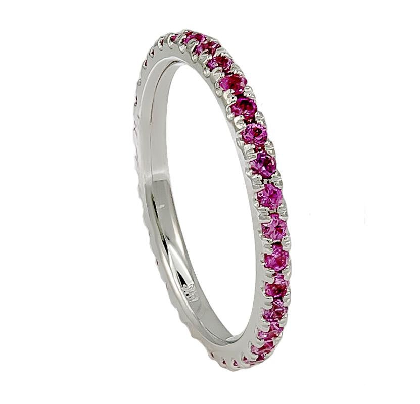 A dainty pink sapphire band that contains approximately 0.90 carats of pink sapphires. This chic ring can be worn single or stacked with the same or multiple colors for a fun accessory! 

The material of this ring is 18K gold.
