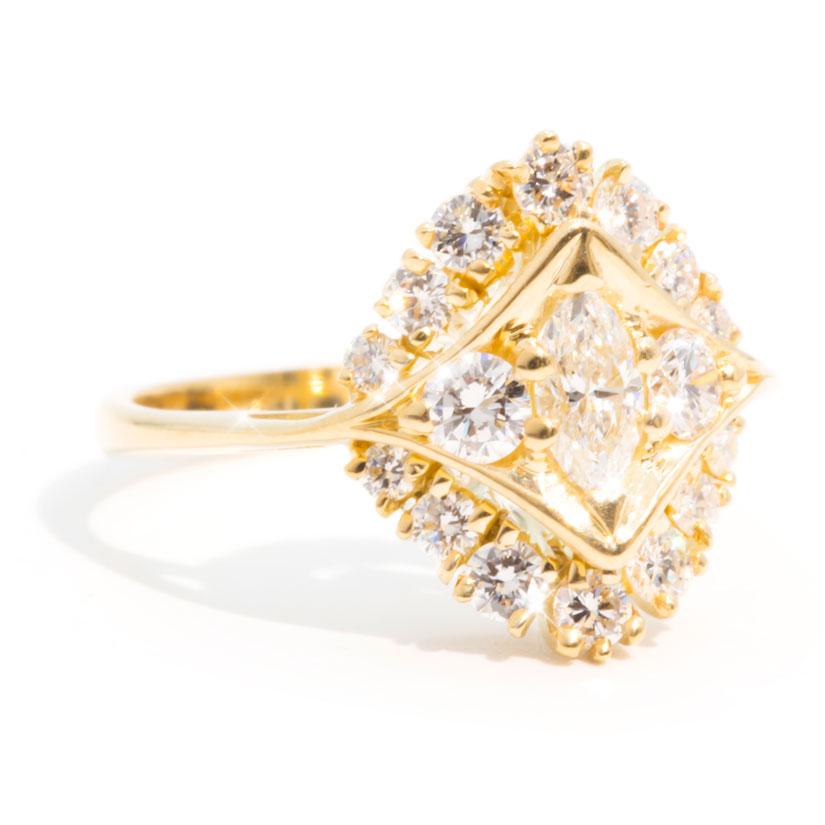 Forged in 18 carat yellow gold, this unique vintage cluster ring features a combination of carefully set glittering marquise and round brilliant cut diamonds in an intricate cluster pattern. We have named this stunning ring The Zelda Ring. She is