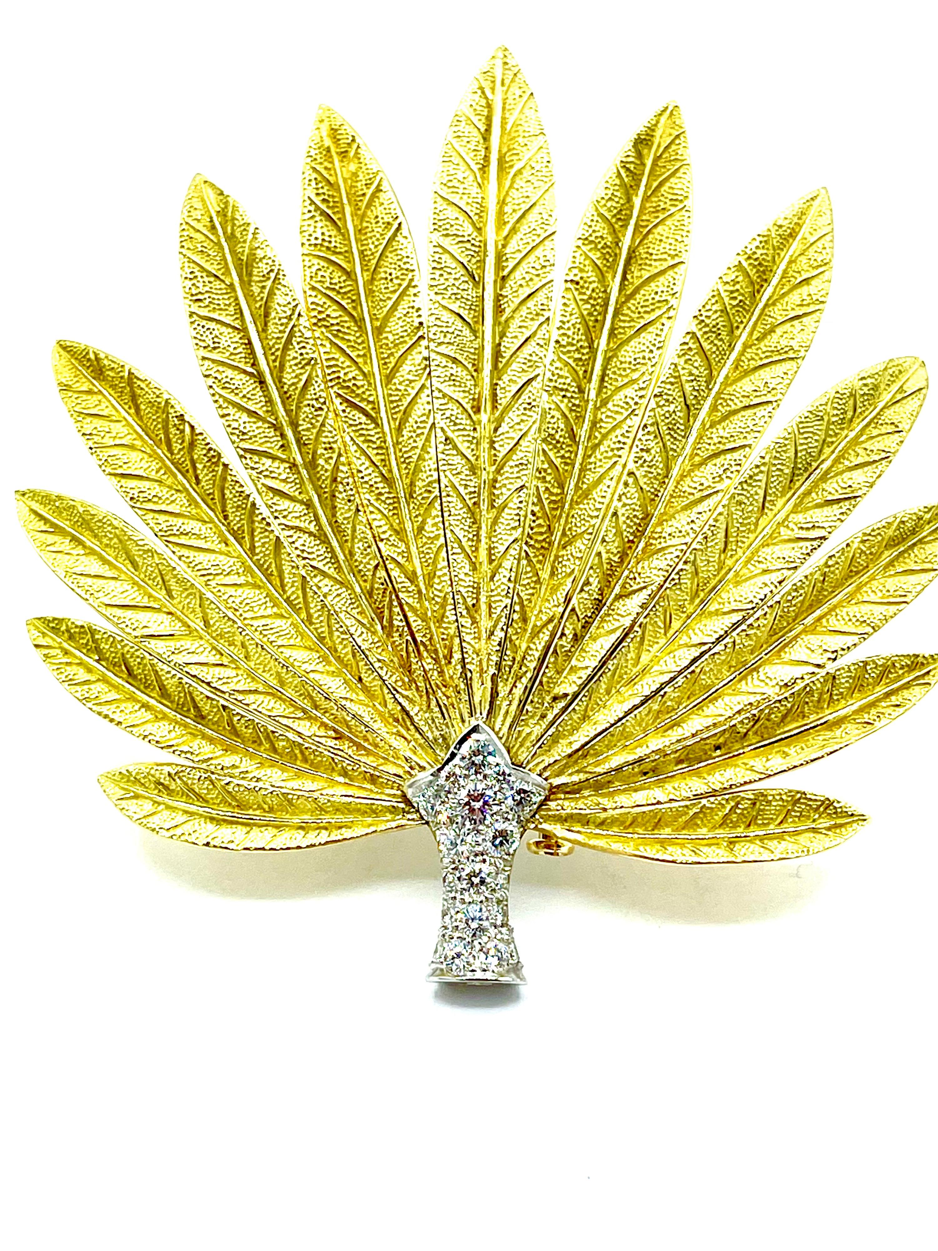 A gorgeous Late 20th Century Diamond feathered fan brooch!  The platinum base is set with 18 round brilliant Diamonds totaling 0.90 carats.  From the base are feathers created in 18K beautifully textured yellow gold, graduating in length as it comes
