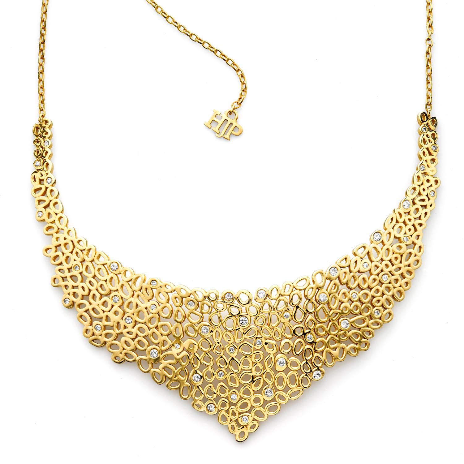 This statement short collar necklace is a great piece to wear to the gala or just a night out with those you love. One of those pieces where you want to look carefully at the elaborate details consisting of Hi June Parker's signature organic circle