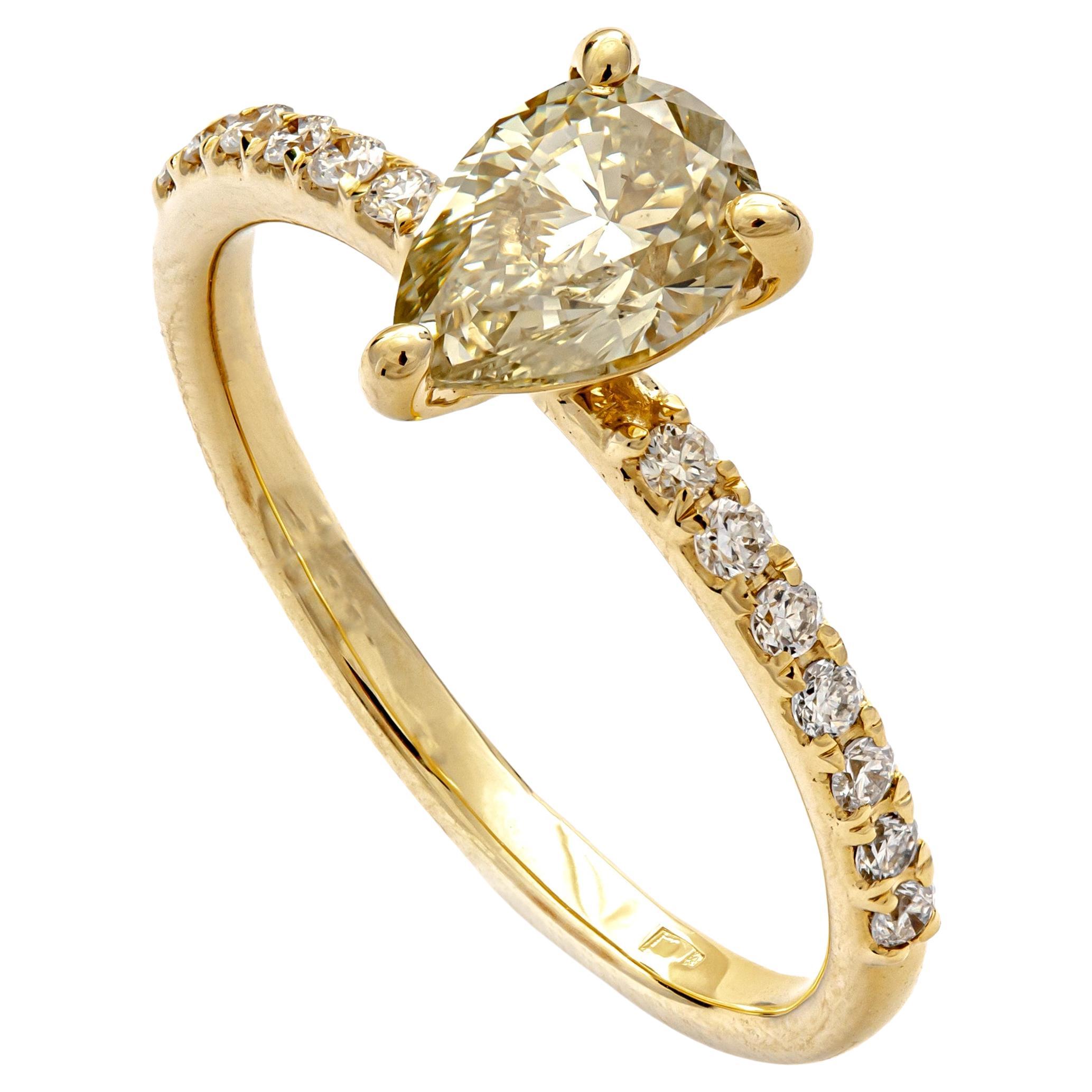 This lot is offered without any reserve price, starting bid $1, highest bid wins.

Elegant ring set with 0.90 ct Natural Fancy Light Grayish Greenish Yellow Pear Diamond at the center of a 14k White Gold frame accented by 0.16 ct Natural White