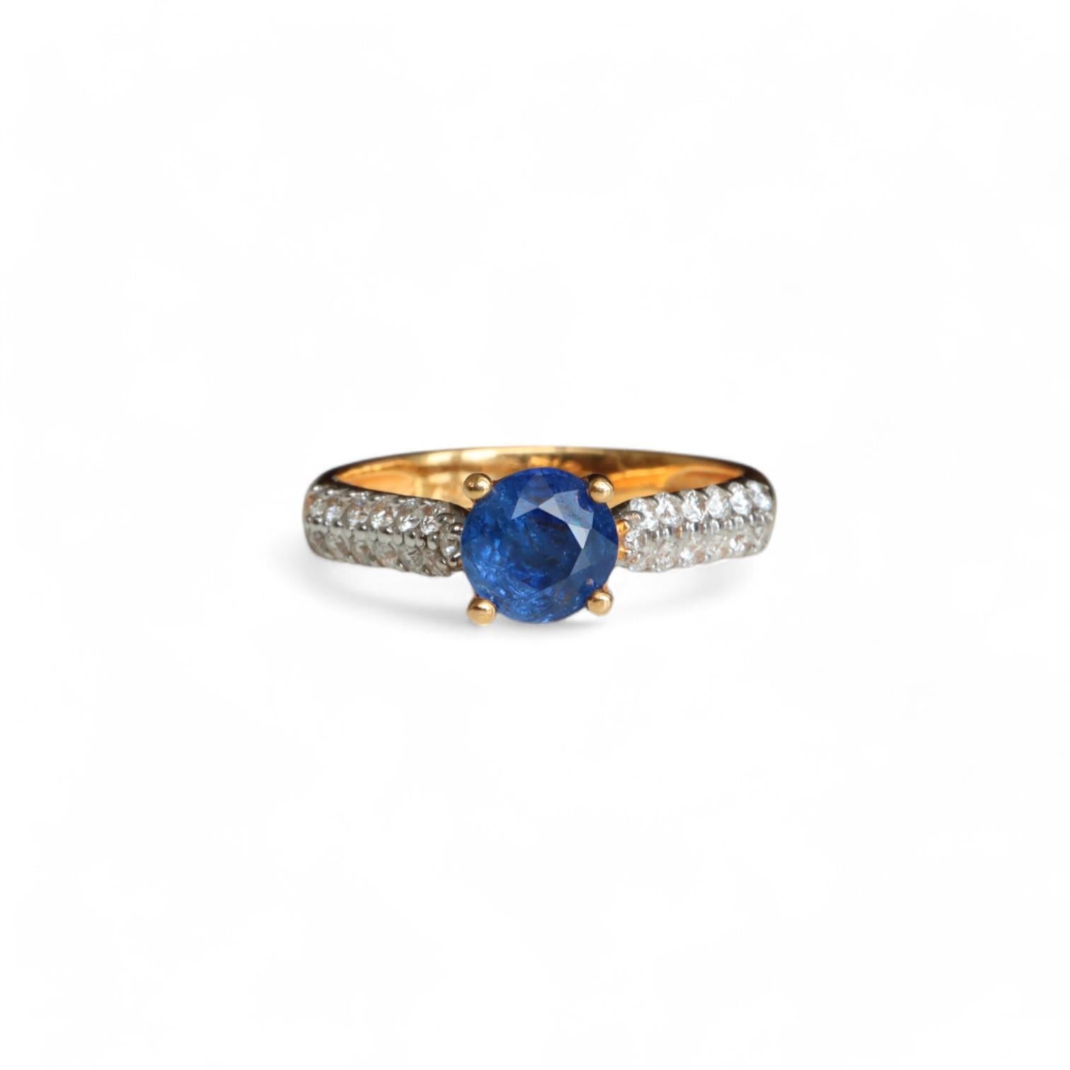 Kindly note that the stated price for this item is fixed and non-negotiable. We appreciate your understanding and respect for our pricing decision.

This ring showcases a solitaire unheated natural blue sapphire weighing 0.9ct, accentuated by a
