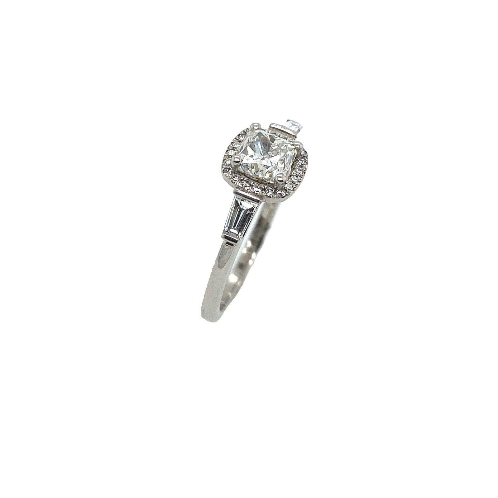 Platinum 0.90ct H Si2 GIA Certified Cushion Shape Diamond Ring

Additional Information:
Central Diamond Weight: 0.90ct
Tapered Diamond Weight: 0.28ct
Round Brilliant Cut Diamonds: 0.10ct
Total Diamond Weight: 1.28ct
Diamond Colour: H
Diamond