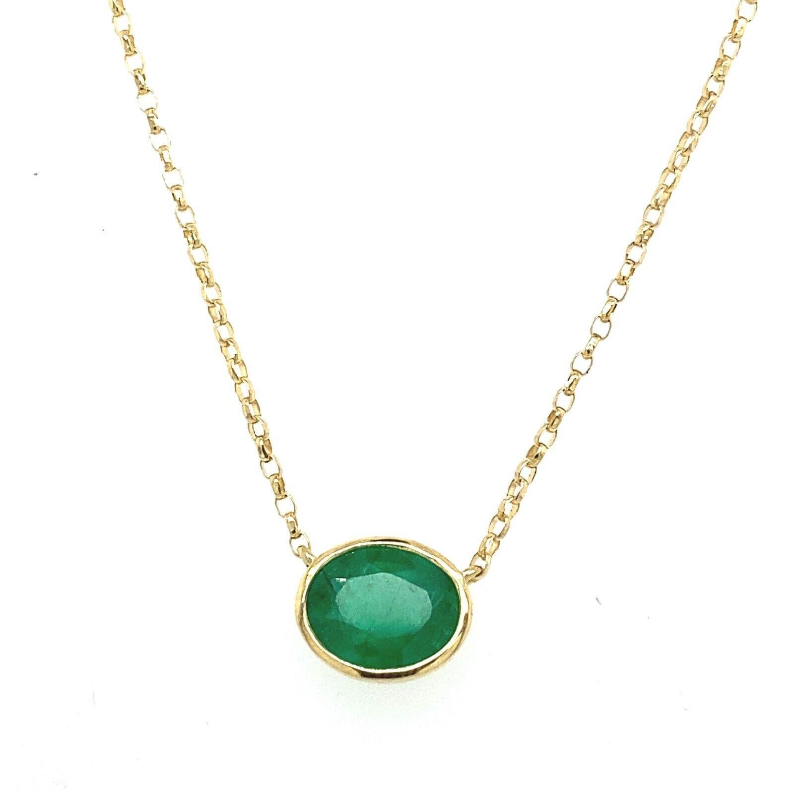 A dazzling Emerald pendant is set in a rubover setting made in 18ct Yellow Gold. The Emerald is a symbol of love, and is the traditional gift for 4th and 17th wedding anniversaries. This pendant has a total Emerald weight of 0.90ct, suspended on 16